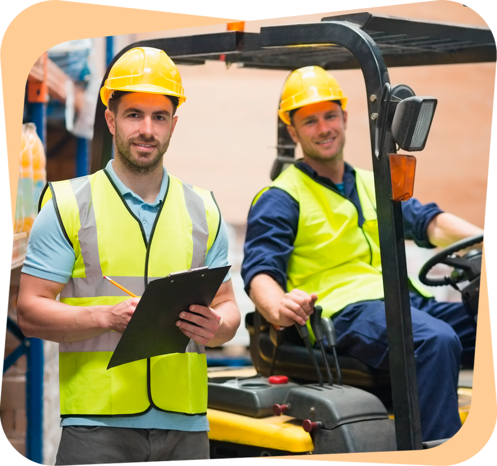 two men in yellow safety vests standing next to a forklift.